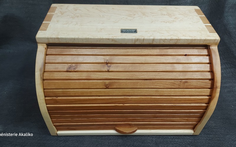 Breadbox 16" x 10" x 10"
Bird's eye maple and cherry.  True tambour sliding door. On order only.